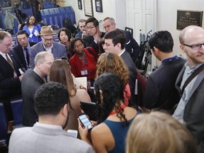 Reporters line up in hopes of attending a briefing in Press Secretary Sean Spicer&#039;s office at the White House in Washington, Friday, Feb. 24, 2017. White House held an off camera briefing in Spicer&#039;s office, where they selected who could attend. (AP Photo/Pablo Martinez Monsivais)