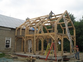 One of the many timber frames Ray Gibbs has built. Though he works alone in his shop, he has a crew to help raise the frames.