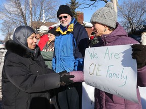 Amne Barakji Deifallah (l) greets and thanks members of the Ottawa community who made a human chain of solidarity and support around the Ottawa Mosque last week.