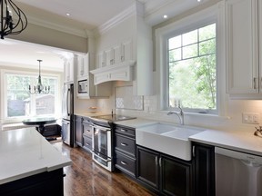 The new kitchen features a stunning contemporary style with ample storage and appliance space.