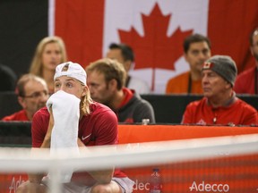 Denis Shapovalov reacts after hitting chair umpire Arnaud Gabas in the eye with a ball and forfeiting the the Davis Cup singles match against Kyle Edmund of Great Britain at TD Place Arena on Sunday, Feb. 5, 2017.