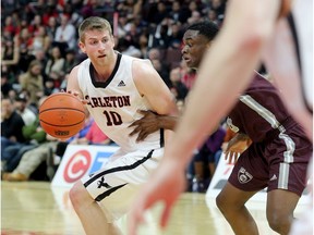 Carlton's Connor Wood plays keep away in the men's action between the Carleton Ravens and the Ottawa Gee Gees during the 11th Annual Capital Hoops Classic at CTC Friday