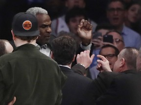 Former New York Knicks player Charles Oakley exchanges words with a security guard during the first half of an NBA basketball game between the New York Knicks and the LA Clippers Wednesday, Feb. 8, 2017, in New York.