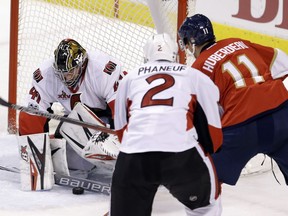 Senators goalie Craig Anderson stops a shot by Panthers forward Jonathan Huberdeau (11) in the second period on Sunday night at Sunrise, Fla.