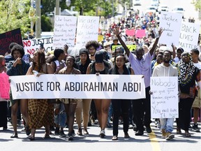 Demonstrators march from Somerset Square park to Ottawa Police headquarter on Elgin street during the March for Justice - In Memory of Abdirahman Abdi. Saturday, July 30, 2016.