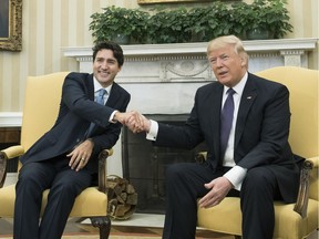 U.S. President Donald Trump shakes hands with Prime Minister Justin Trudeau of Canada during a meeting in the Oval Office at the White House on February 13, 2017 in Washington, D.C. This is the first time the two leaders are meeting at the White House.