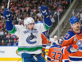 Alex Burrows celebrates a Canucks goal during that team's Dec. 31 game against the Oilers in Edmonton. AMBER BRACKEN/EDMONTON JOURNAL