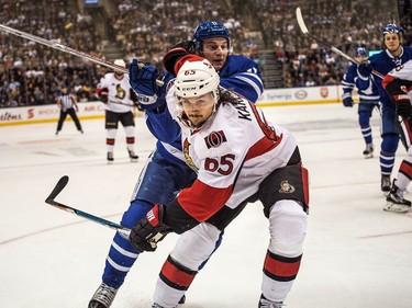 Ottawa Senators defenceman Erik Karlsson (65) fends of Toronto Maple Leafs centre Zach Hyman..