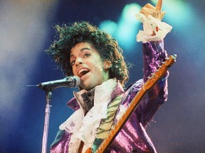 In this Feb. 18, 1985 file photo, Prince performs at the Forum in Inglewood, California.