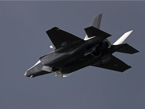 (FILES) This file photo taken on July 12, 2016 shows a Lockheed Martin F-35 Lightning II taking part in a flying display at the Farnborough Airshow, south west of London.  Lockheed Martin and the Pentagon on February 3, 2017 said the next batch of F-35 stealth fighters, the most expensive planes in history, will be produced at a reduced cost. They announced $728 million in savings after President Donald Trump publically upbraided Lockheed over "out of control" costs, although most of the savings were already planned ahead of his involvement, during a months-long contract negotiation.   /