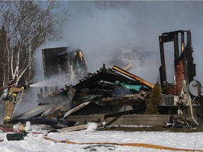Many fire trucks were called to put out a house fire at 6703 Dwyer Hill Road outside Ottawa Wednesday Feb 1, 2017. No one was injured  in the fire.