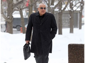 Former construction boss and spy Roland Eid walks in to the Ottawa court on Tuesday.