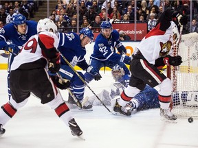 Toronto Maple Leafs goalie Frederik Andersen, left-winger Matt Martin (15), defenceman Morgan Rielly (44) and centre Tyler Bozak (42) look for the puck as the Ottawa Senators try to score on a rebound during the first period on Saturday, Feb. 18 2017.
