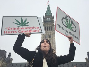 Jodie Emery demonstrates with some friends on Parliament Hill on Wednesday for an end to cannabis arrests and raids.