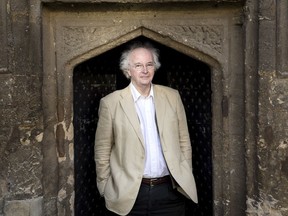 In this Jan. 11, 2017 photo provide by Penguin Random House, author Philip Pullman poses for a photograph outside of Worcester College, in Oxford, England. The irrepressible young heroine of Pullman's fantasy saga "His Dark Materials" returns in a new novel being published in Britain and the U.S. on Oct. 19, the first part of a trilogy called "The Book of Dust." (Michael Leckie/Penguin Random House via AP) ORG XMIT: AMB808