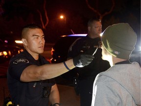 A California police officer conducts a field sobriety test on a driver suspected of driving while under the influence of marijuana.