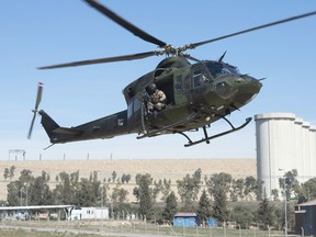 A Canadian Forces Griffon helicopter comes in for a landing near the Mosul dam, February 20, 2017 in northern Iraq. THE CANADIAN PRESS/Ryan Remiorz ORG XMIT: RYR113