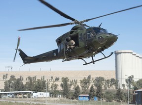 A Canadian Forces Griffon helicopter comes in for a landing near the Mosul dam, February 20, 2017 in northern Iraq. THE CANADIAN PRESS/Ryan Remiorz ORG XMIT: RYR113