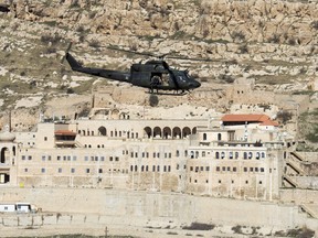 A Canadian Forces Griffon helicopter passes the Monastery of Mar Mattai/St Matthew, February 20, 2017 in northern Iraq. THE CANADIAN PRESS/Ryan Remiorz ORG XMIT: RYR111