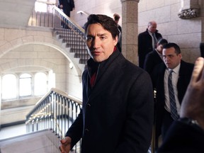 Prime Minister Justin Trudeau walks past reporters on Parliament Hill, in Ottawa, Tuesday, February 1, 2017.