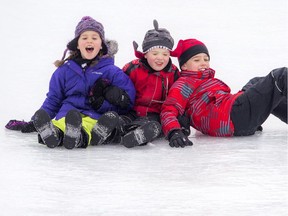 L-R: Seven-year-old Emma, five-year-old Sean and nine-year-old Draden Watkins loved Winterlude's giant ice slide in Jacques Cartier Park, Saturday, Feb. 4, 2017.