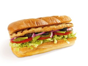 Photo of Subway roasted chicken sandwich on white background.