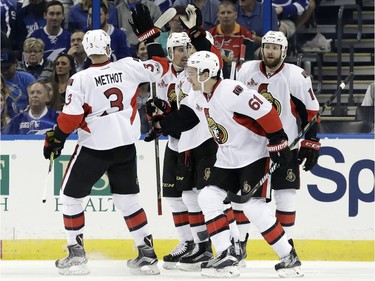 Ottawa Senators right wing Mark Stone (61) celebrates with teammates, including defenseman Marc Methot (3), after scoring against the Tampa Bay Lightning during the second period of an NHL hockey game Thursday, Feb. 2, 2017, in Tampa, Fla.