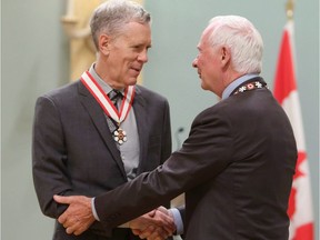 Author and humourist Stuart McLean is presented with the Officer of the Order of Canada medal by Governor General David Johnston in Ottawa on Friday, September 28, 2012. McLean, a bestselling author, journalist and humorist who entertained millions as host of the popular CBC Radio program ``The Vinyl Cafe,'' has died. He was 68.