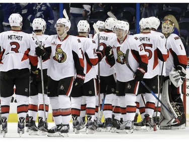 Ottawa Senators goalie Mike Condon (1) celebrates with teammates after the team defeated the Tampa Bay Lightning 5-2 during an NHL hockey game Thursday, Feb. 2, 2017, in Tampa, Fla.
