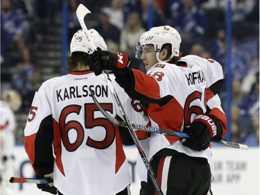 Ottawa Senators left wing Mike Hoffman (68) celebrates with defenseman Erik Karlsson (65), of Sweden, after scoring against the Tampa Bay Lightning during the third period of an NHL hockey game Thursday, Feb. 2, 2017, in Tampa, Fla. The Senators won 5-2.