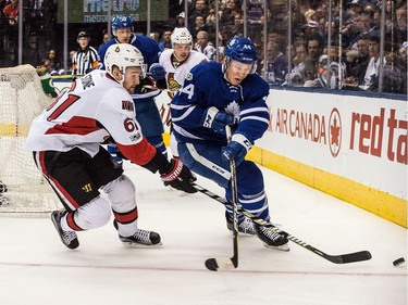 The Senators' Mark Stone tries for yet another takeaway against the Leafs' Morgan Rielly.