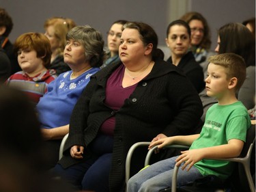 Nancy Cober, second from left, and her son, Lucas Hood, left, and Danny Martin, right, and his mom, Caroline Laviollette attended the  school board meeting.