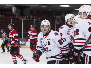 Niagara IceDogs #23 Johnny Corneil celebrates his goal with team mates during the game against the Ottawa 67's at TD Place Arena Sunday February 26, 2017.