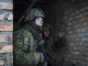 Lieutenant (Lt) Bennett, Platoon Commander of 1 Platoon, Alpha Company (A Coy), 1 Princess Patricia's Canadian Light Infantry (1 PPCLI), gives the thumbs up on urban operations training during Exercise MAPLE DETACHMENT 5 (MD5) in Wedrzyn Training Area Poland as part of Operation REASSURANCE on January 25, 2017. Photo: Cpl Jay Ekin.