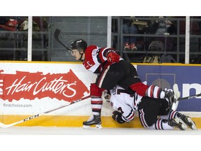 Ottawa 67's #19 Travis Barron got a two minute penalty for checking Niagara IceDogs #17 William Lochead from behind during the game at TD Place Arena Sunday February 26, 2017.