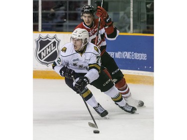 The 67's Chris Martenet pursues the Knights' Janne Kuokkanen.