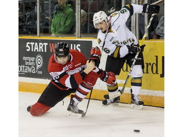 Ottawa 67's Kevin Bahl swipes the puck away from London Knights Dante Salituro during OHL action at TD Arena on Monday February 20, 2017. Errol McGihon/Postmedia