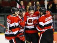 The Ottawa 67's Kody Clark is congratulated by teammates Mitchell Hoelscher (44), Sasha Chmelevski (8) and Noel Hoefenmayer (2) after he scored against the Oshawa Generals at TD Place arena on Friday, Feb. 24,2017.
