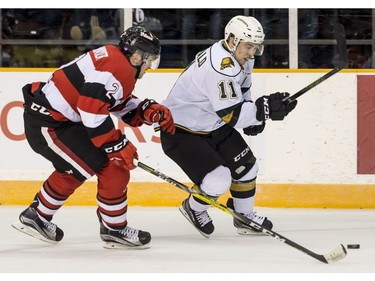 The Ottawa 67's Noel Hoefenmayer pursues London's Owen MacDonald.