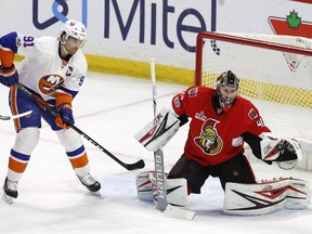 Ottawa Senators goalie Craig Anderson makes a save as New York Islanders centre John Tavares (91) looks on during the first period at the Canadian Tire Centre on, Saturday, Feb. 11, 2017.