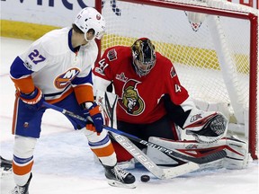 Ottawa Senators goalie Craig Anderson (41) makes a save on New York Islanders left wing Anders Lee (27) during third period NHL hockey action in Ottawa on, Saturday February 11, 2017.
