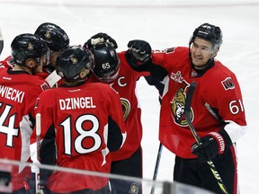 Ottawa Senators right wing Mark Stone (61) celebrates his goal against the New York Islanders with teammates during first period NHL hockey action in Ottawa on February 11, 2017.