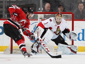 Ottawa Senators goalie Mike Condon stops a shot by Sergey Kalinin of the New Jersey Devils in the first period on Thursday, Feb. 16, 2017 at the Prudential Center in Newark.