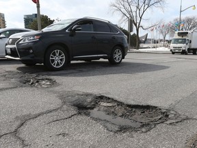 A pot hole on Wellington Street in Ottawa, February 27, 2017.