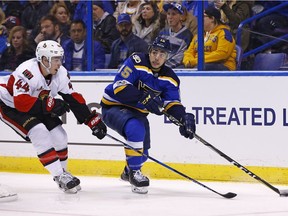St. Louis Blues' Robby Fabbri, right, looks to pass the puck as he is pressured by Ottawa Senators' Jean-Gabriel Pageau during the game on Tuesday, Jan. 17, 2017, in St. Louis.