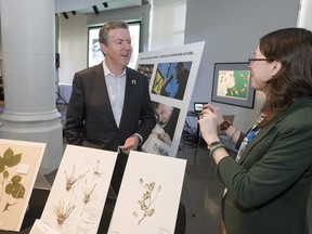 Ross Beaty speaks to Museum of Nature collections technician Cassandra Robillard, right, followin the announcement of a $4 million gift from the Ross Beaty family to the Canadian Museum of Nature, on Thursday, Feb. 23, 2017 in Ottawa.