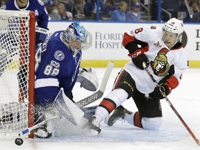 Ottawa Senators left wing Ryan Dzingel (18) shoots wide of Tampa Bay Lightning goalie Andrei Vasilevskiy, of Russia, during the first period of an NHL hockey game Thursday, Feb. 2, 2017, in Tampa, Fla.