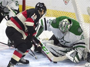 Ottawa Senators left wing Ryan Dzingel (18) pressures Dallas Stars goalie Kari Lehtonen (32) as he controls the puck during second period NHL hockey action in Ottawa on Thursday February 9, 2017.