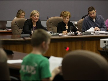 School board trustees listen to Danny Martin speak during the meeting.