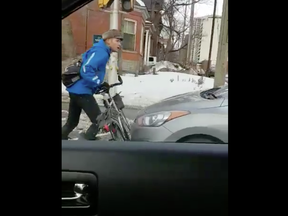 Screen capture from video uploaded to Twitter of a confrontation between a cyclist and driver on Bronson Avenue in January.